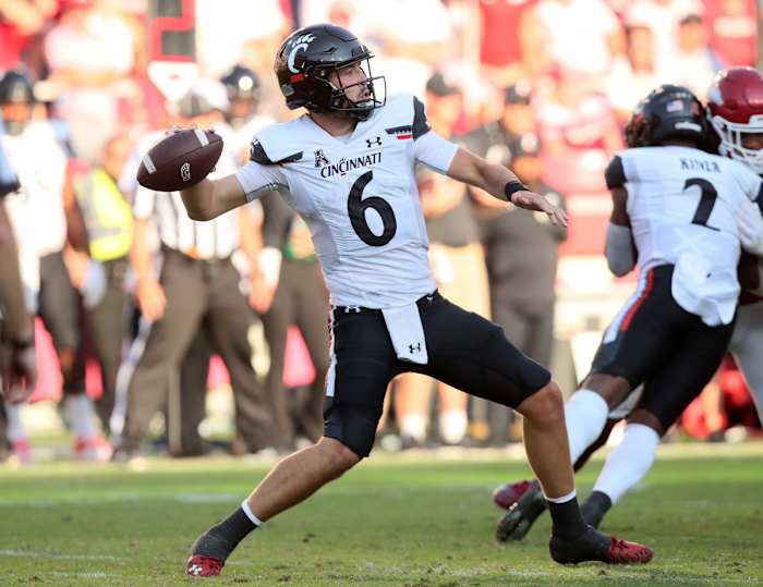 Sep 3, 2022; Fayetteville, Arkansas, USA; Cincinnati Bearcats quarterback Ben Bryant (6) throws apass against the Arkansas Razorbacks in the fourth quarter at Donald W. Reynolds Razorback Stadium. Arkansas won 31-24. Mandatory Credit: Nelson Chenault-USA TODAY Sports